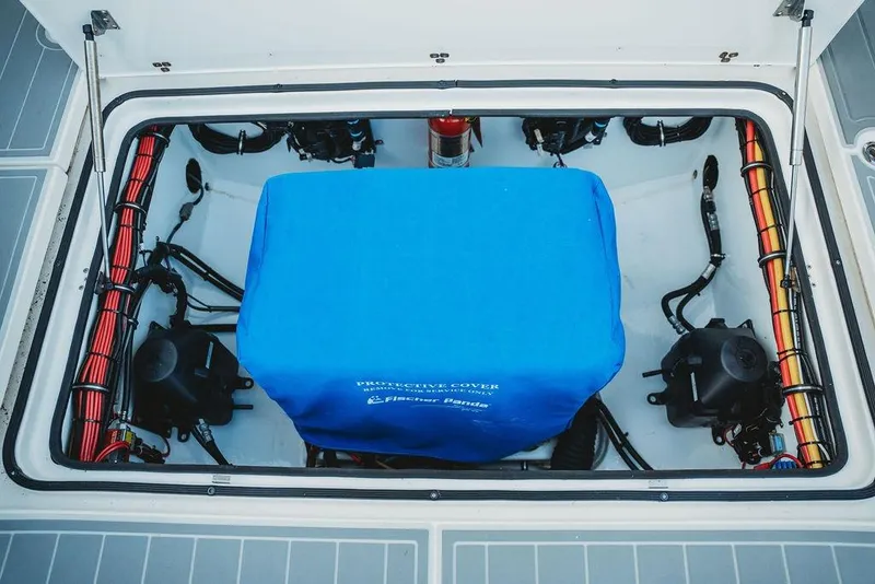 Slide: The Image of Engine compartment of 2018 MTI 57 boat with protective cover and wiring. - 72