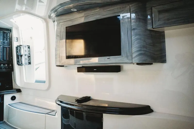 Slide: The Image of Luxurious MTI 57 yacht interior with modern TV setup, 2018 model. - 48