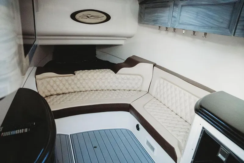 Slide: The Image of Luxurious interior of a 2018 MTI 57 boat with plush seating and elegant cabinetry. - 44