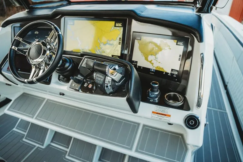 Slide: The Image of Cockpit of 2018 MTI 57 boat with advanced navigation displays and controls. - 33