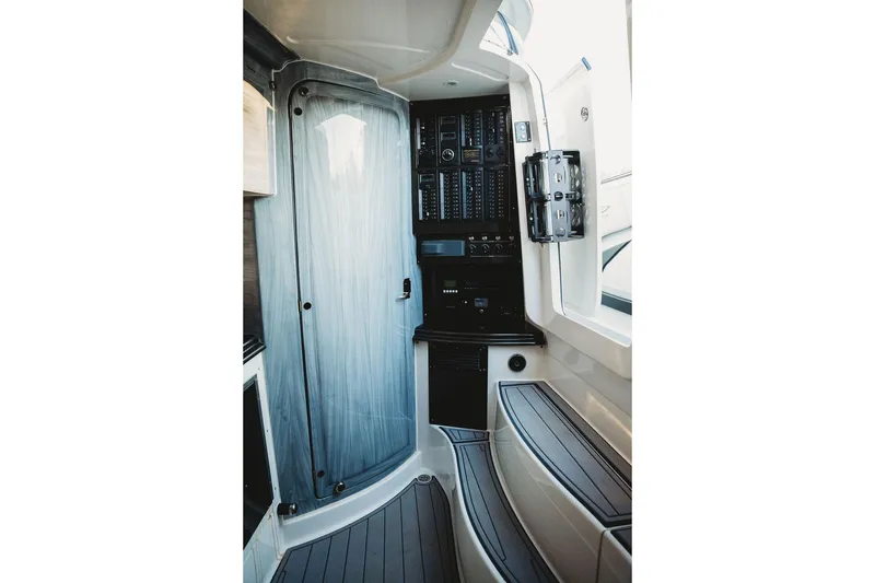 Slide: The Image of Interior of 2018 MTI 57 boat featuring control panels and sleek design elements. - 47