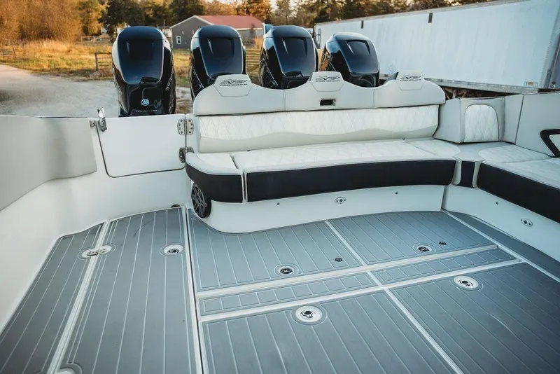 Slide: The Image of Luxury MTI 57 boat interior with sleek seating and powerful outboard engines, 2018 model. - 69