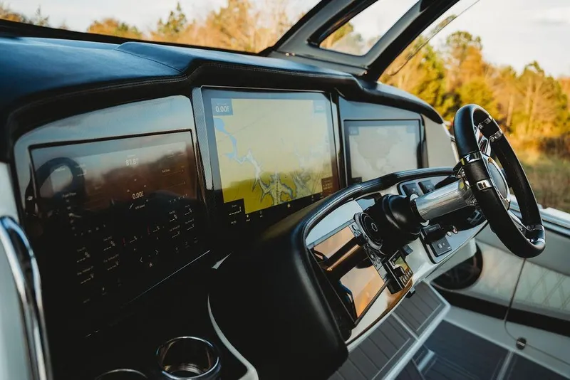 Slide: The Image of Cockpit of 2018 MTI 57 boat with advanced navigation displays and steering wheel. - 27