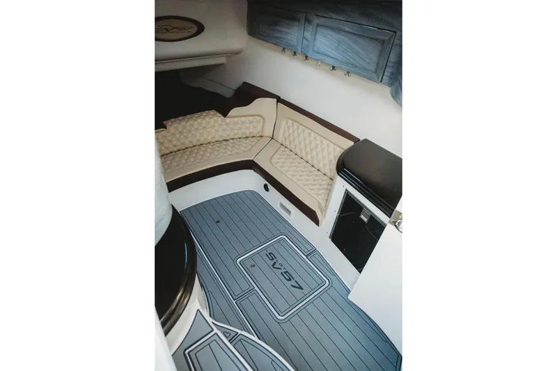 Slide: The Image of Luxurious interior of 2018 MTI 57 boat with cushioned seating and sleek flooring. - 50