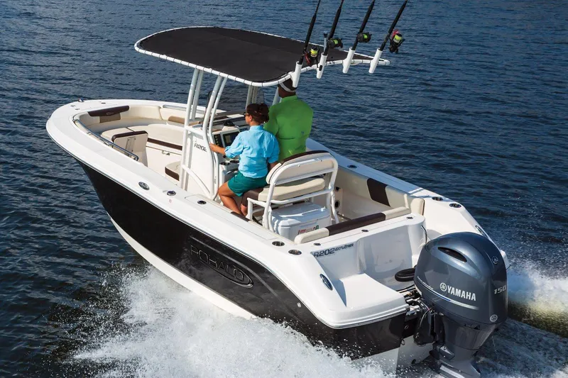 Slide: The Image of Manufacturer Provided Image: 2025 Robalo R202 Explorer boat cruising on water with Yamaha engine. - 2