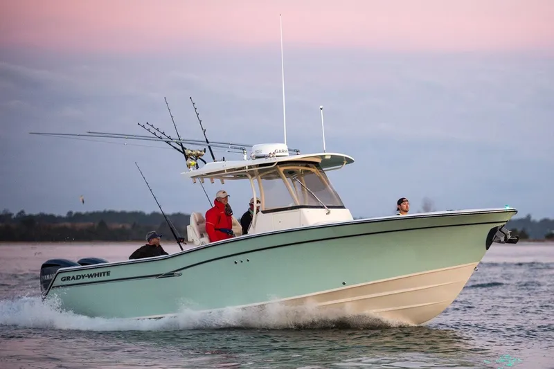 Slide: The Image of Manufacturer Provided Image: 2021 Grady-White Canyon 306 boat cruising on water at sunset. - 32