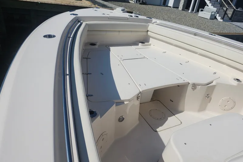 Slide: The Image of 2021 Grady-White Canyon 306 boat deck, spacious and well-equipped for fishing and leisure. - 20