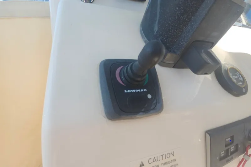 Slide: The Image of Control panel of a 2021 Grady-White Canyon 306 boat featuring Lewmar joystick. - 27