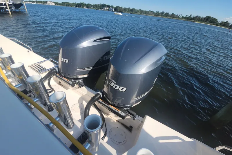 Slide: The Image of 2021 Grady-White Canyon 306 boat with twin Yamaha 300 outboard engines on a sunny day. - 29