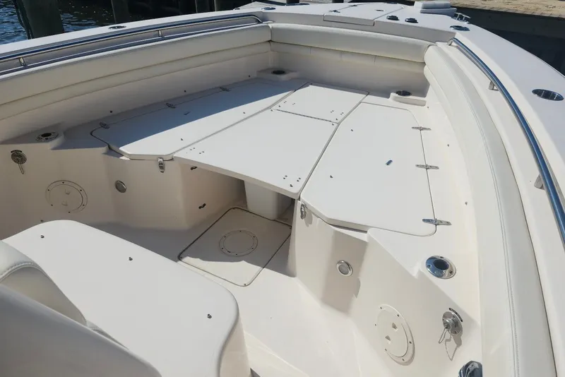 Slide: The Image of 2021 Grady-White Canyon 306 boat interior with spacious seating and storage compartments. - 19