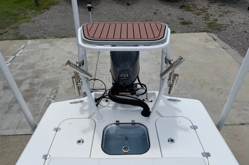 Slide: The Image of 2018 Bomb Island 160 Side Console boat with motor and fishing rod holders. - 13