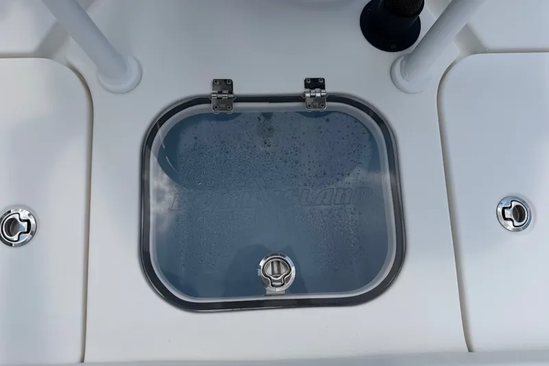 Slide: The Image of 2018 Bomb Island 160 Side Console boat hatch with secure latches and sleek design. - 16