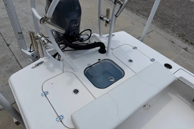 Slide: The Image of 2018 Bomb Island 160 Side Console boat with Yamaha 70 engine, featuring rod holders and storage compartments. - 15