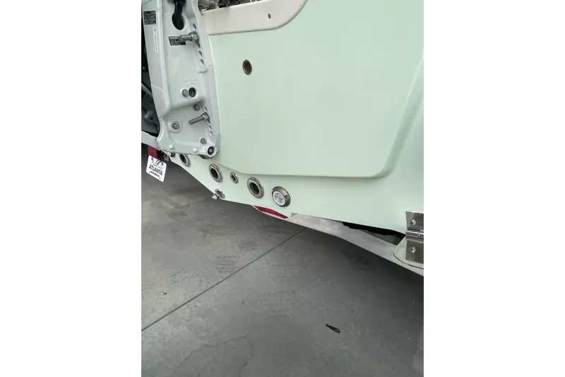 Slide: The Image of 2026 Bulls Bay 2400 boat transom detail with fittings and hardware. - 10