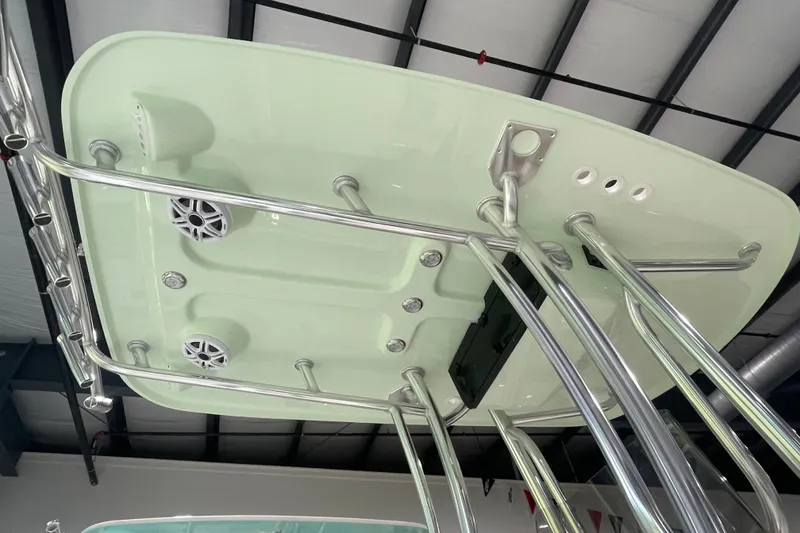Slide: The Image of 2026 Bulls Bay 2400 boat T-top with speakers and stainless steel supports. - 7