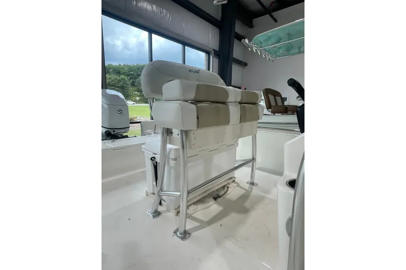 Slide: The Image of 2026 Bulls Bay 2400 boat interior with cushioned seating and stainless steel frame. - 5