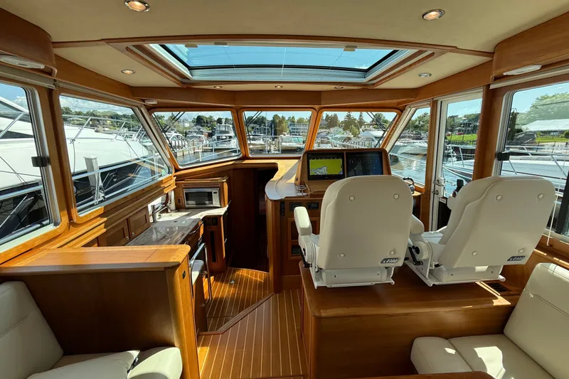 Slide: The Image of Interior of 2018 Sabre 45 Salon Express yacht with luxurious seating and navigation equipment. - 40