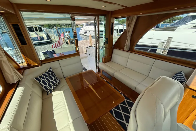 Slide: The Image of Luxurious interior of 2018 Sabre 45 Salon Express yacht with elegant seating and wooden accents. - 36