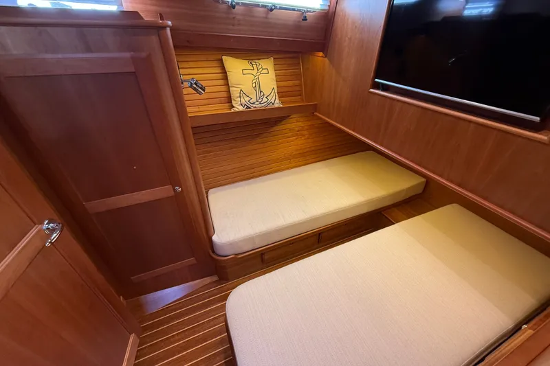 Slide: The Image of 2018 Sabre 45 Salon Express cabin with twin beds and nautical decor. - 62