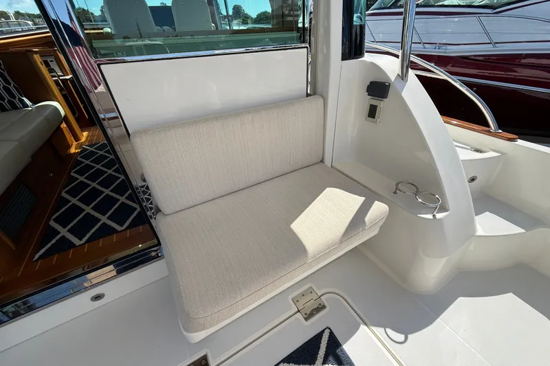 Slide: The Image of 2018 Sabre 45 Salon Express interior with cushioned seating and elegant design. - 25