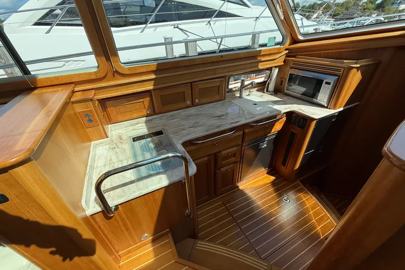 Slide: The Image of Luxurious 2018 Sabre 45 Salon Express yacht interior with modern kitchen amenities. - 50