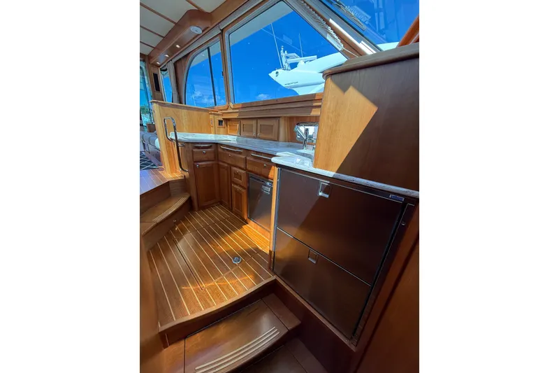 Slide: The Image of Interior of 2018 Sabre 45 Salon Express yacht with wooden cabinetry and modern appliances. - 53