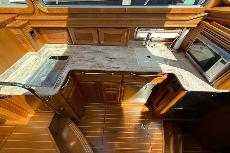 Slide: The Image of Luxurious kitchen interior of 2018 Sabre 45 Salon Express yacht with wood cabinetry. - 51