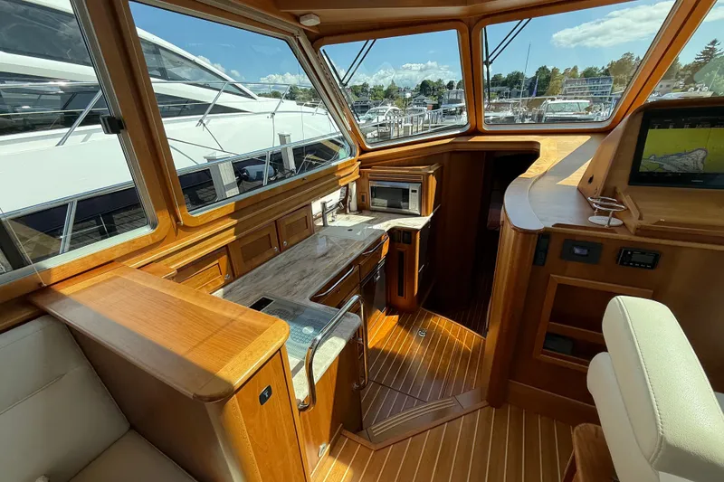 Slide: The Image of Interior of 2018 Sabre 45 Salon Express yacht with wood finish and modern amenities. - 48
