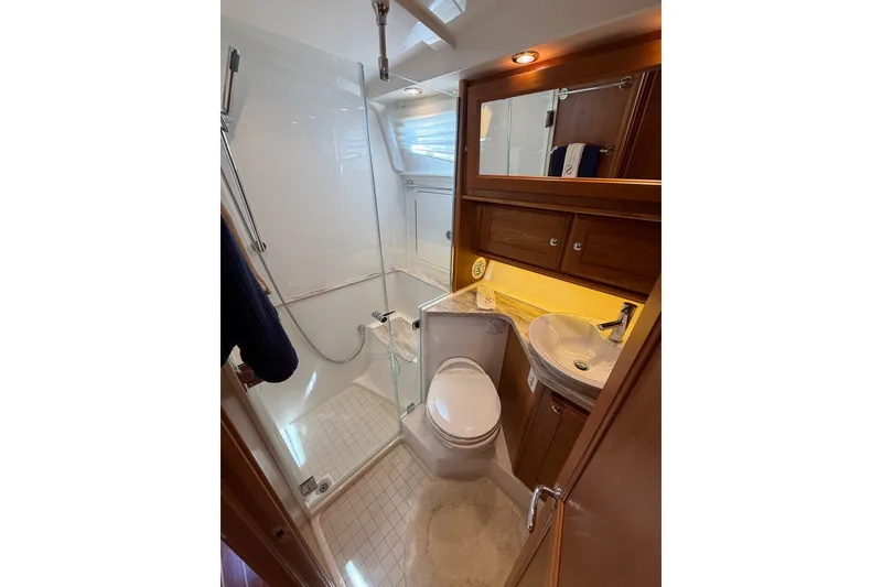 Slide: The Image of Luxurious bathroom in 2018 Sabre 45 Salon Express yacht with shower and vanity. - 64