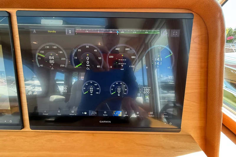 Slide: The Image of Dashboard display of a 2018 Sabre 45 Salon Express with various gauges and controls. - 45