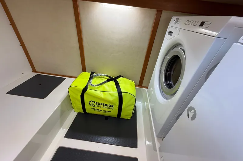 Slide: The Image of Laundry area on 2018 Sabre 45 Salon Express with life-saving equipment bag. - 68