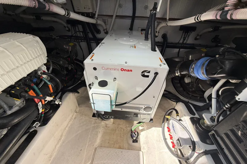 Slide: The Image of Engine room of 2018 Sabre 45 Salon Express with Cummins Onan generator. - 79