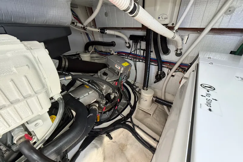 Slide: The Image of Engine room of 2018 Sabre 45 Salon Express with visible machinery and wiring. - 77