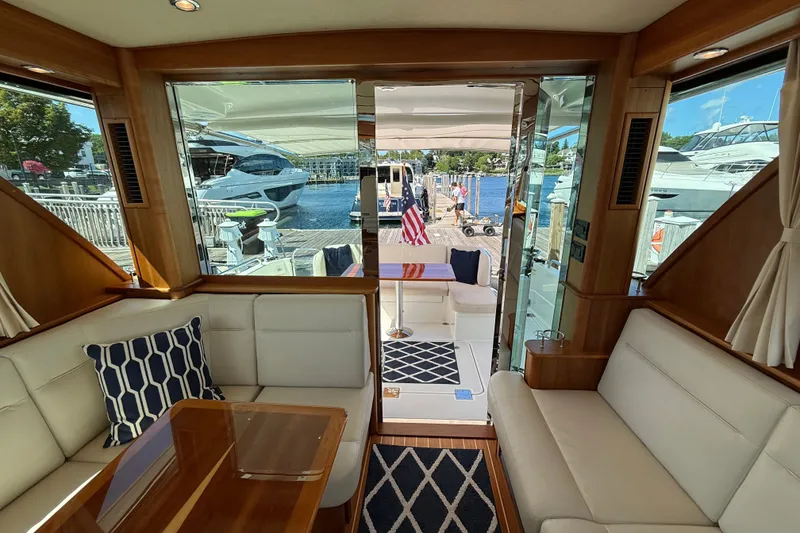 Slide: The Image of Interior view of 2018 Sabre 45 Salon Express yacht with elegant seating and dockside view. - 39