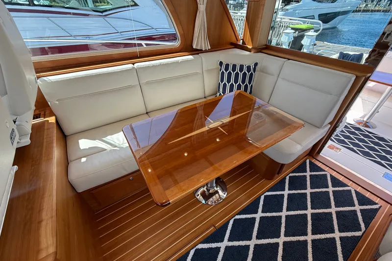 Slide: The Image of Elegant interior of 2018 Sabre 45 Salon Express with plush seating and wooden table. - 38