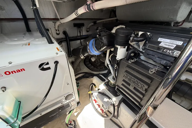 Slide: The Image of Engine room of 2018 Sabre 45 Salon Express with Cummins Onan generator and Volvo Penta components. - 76