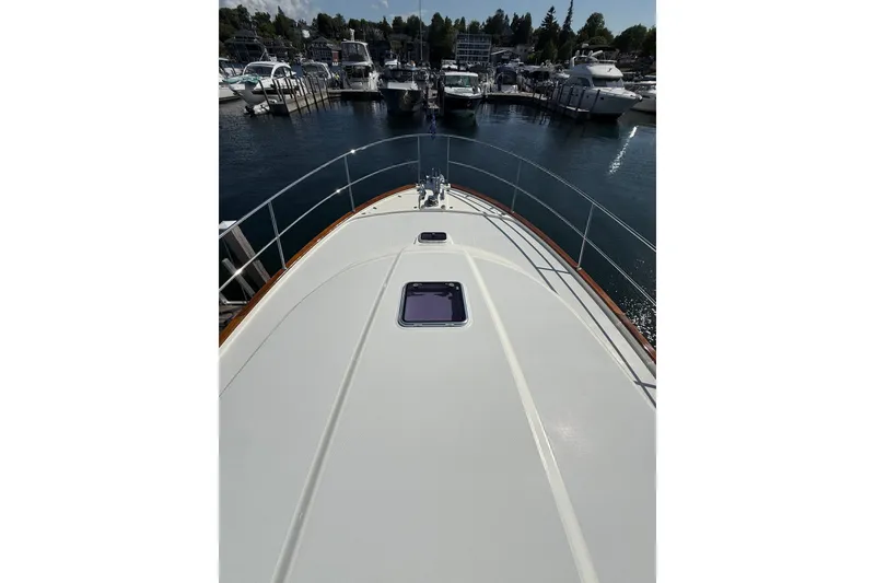 Slide: The Image of 2018 Sabre 45 Salon Express yacht docked at marina, view from bow. - 17