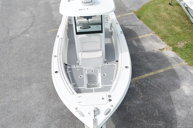 Slide: The Image of 2023 Sea Hunt Ultra 255SE boat, aerial view showcasing spacious deck and seating. - 14