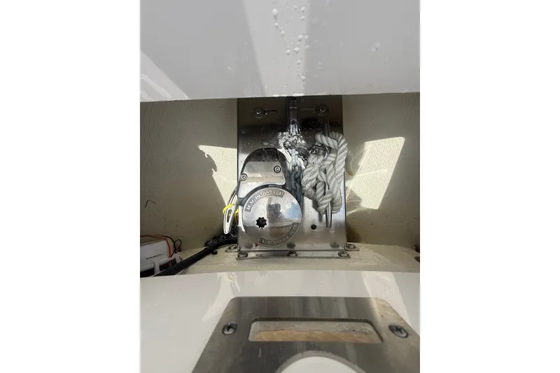 Slide: The Image of Regulator 25 boat anchor system, 2025 model, featuring stainless steel components and rope. - 23