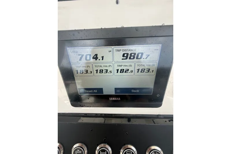 Slide: The Image of Display screen on a 2025 Regulator 25 boat showing fuel usage and trip distance. - 6