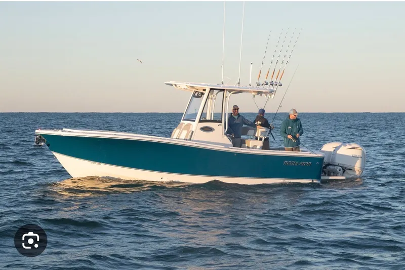 The Image of 2025 Regulator 25 boat with anglers fishing on open water. - 0