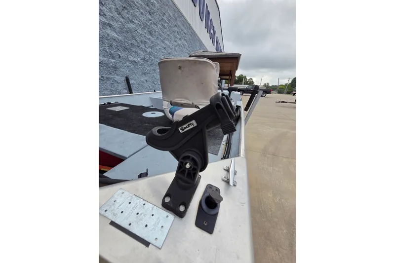 Slide: The Image of 1997 Lowe Bass Striker 170 boat with mounted fishing rod holder and accessories. - 8
