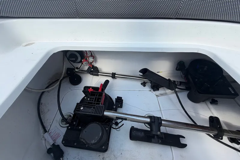 Slide: The Image of 2019 Hurricane SunDeck 2400 OB boat interior showing mechanical components and wiring. - 69