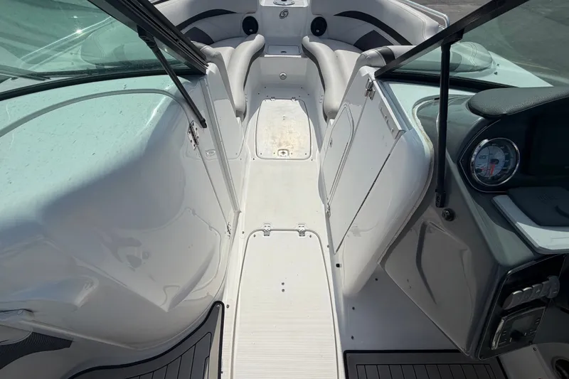 Slide: The Image of 2019 Hurricane SunDeck 2400 OB boat interior with seating and dashboard view. - 38
