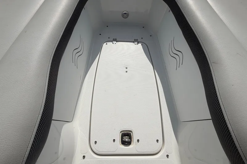 Slide: The Image of The image shows the bow area of a boat with gray upholstery and a white floor. - 41