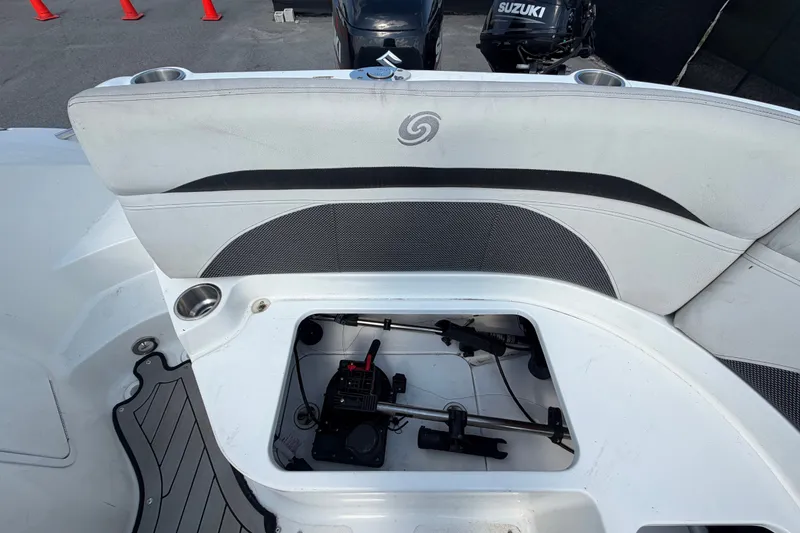 Slide: The Image of 2019 Hurricane SunDeck 2400 OB boat interior with open storage compartment. - 68