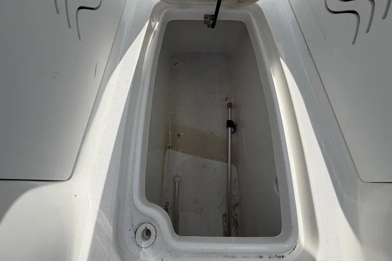 Slide: The Image of An open storage compartment on a 2019 Hurricane SunDeck 2400 OB boat. - 42