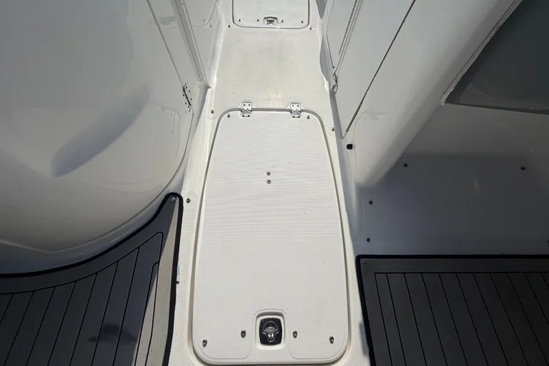 Slide: The Image of 2019 Hurricane SunDeck 2400 OB boat deck with storage compartment. - 36