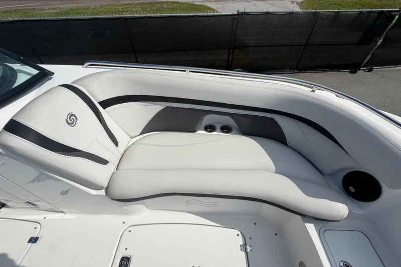 Slide: The Image of 2019 Hurricane SunDeck 2400 OB boat interior with white cushioned seating. - 44