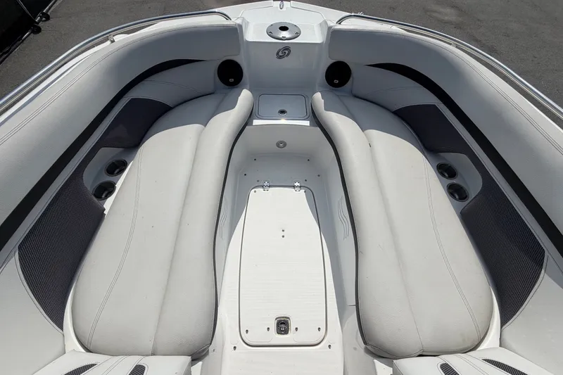 Slide: The Image of The image shows the bow area of a 2019 Hurricane SunDeck 2400 OB with white upholstery. - 43